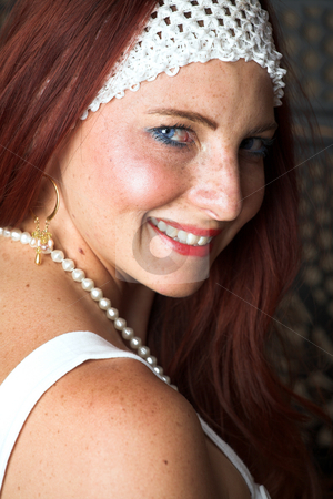 To use this stock image in your creative project, please select the size you need over to the right and click the "Add to Cart" button.
Your downloaded image will come with the Cutcaster watermark removed so don’t worry about the watermark you see on this page. Female Fashion Model stock photo, Young female adult fashion model with natural red hair and freckles in a white summers dress and white headband (textured wooden background) by Sean Nel