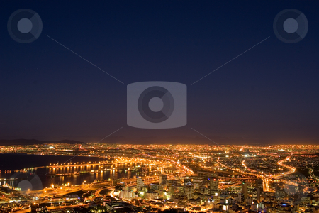 To use this stock image in your creative project, please select the size you need over to the right and click the "Add to Cart" button.
Your downloaded image will come with the Cutcaster watermark removed so don’t worry about the watermark you see on this page. Lights #1 stock photo, Downtown Cape Town and Harbour at night - South Africa by Sean Nel