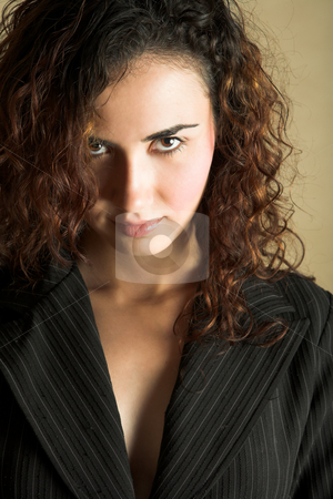 To use this stock image in your creative project, please select the size you need over to the right and click the "Add to Cart" button.
Your downloaded image will come with the Cutcaster watermark removed so don’t worry about the watermark you see on this page. Young adult woman stock photo, Portrait of a beautiful young adult Caucasian woman with light skin and curly brown hair, brown eyes and pink lips, wearing a pinstripe Jacket by Sean Nel