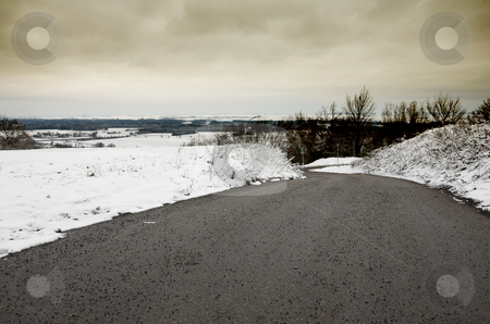 To use this stock image in your creative project, please select the size you need over to the right and click the "Add to Cart" button.
Your downloaded image will come with the Cutcaster watermark removed so don’t worry about the watermark you see on this page. Snow Landscape #6 stock photo, Cleared road going down the mountain by Sean Nel