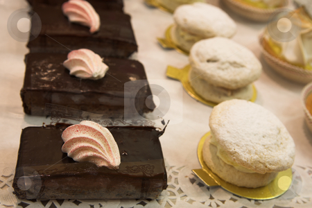 To use this stock image in your creative project, please select the size you need over to the right and click the "Add to Cart" button.
Your downloaded image will come with the Cutcaster watermark removed so don’t worry about the watermark you see on this page. Pastry #21 stock photo, White and Pink Meringue on a Chocolate Brownie by Sean Nel