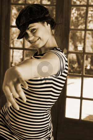 To use this stock image in your creative project, please select the size you need over to the right and click the "Add to Cart" button.
Your downloaded image will come with the Cutcaster watermark removed so don’t worry about the watermark you see on this page. Sexy modern dancer in Black hat and striped top stock photo, Modern Dancer in black Hat and striped top - Practicing in Studio. Shallow Depth of Field, Focus on Face by Sean Nel