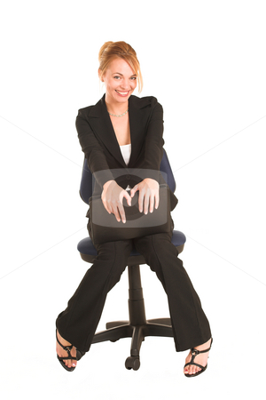 To use this stock image in your creative project, please select the size you need over to the right and click the "Add to Cart" button.
Your downloaded image will come with the Cutcaster watermark removed so don’t worry about the watermark you see on this page. Businesswoman #265 stock photo, Blonde business lady in formal black suit. Sitting on an office chair, holding a file. by Sean Nel