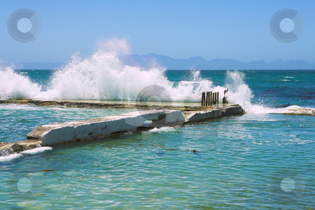 To use this stock image in your creative project, please select the size you need over to the right and click the "Add to Cart" button.
Your downloaded image will come with the Cutcaster watermark removed so don’t worry about the watermark you see on this page. Wavebreak stock photo, Wave breaking against the harbor wall, Kalk Bay, Western Cape, South Africa by Sean Nel