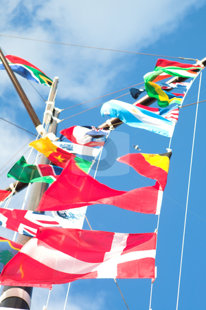To use this stock image in your creative project, please select the size you need over to the right and click the "Add to Cart" button.
Your downloaded image will come with the Cutcaster watermark removed so don’t worry about the watermark you see on this page. Flags of the world stock photo, Various flags of various countries displayed together on a signal mast of a ship (focus on the red flags at the bottom) by Sean Nel