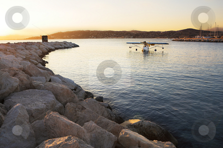 To use this stock image in your creative project, please select the size you need over to the right and click the "Add to Cart" button.
Your downloaded image will come with the Cutcaster watermark removed so don’t worry about the watermark you see on this page. Float plane stock photo, A seaplane (microlight) in a private bay - Antibes (Juan Les Pins), France by Sean Nel