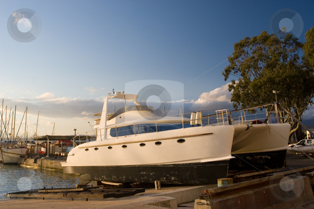 To use this stock image in your creative project, please select the size you need over to the right and click the "Add to Cart" button.
Your downloaded image will come with the Cutcaster watermark removed so don’t worry about the watermark you see on this page. Cape Boat #7 stock photo, Catamaran in Drydock - Gordonsbay, South Africa by Sean Nel