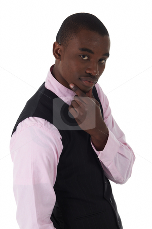 To use this stock image in your creative project, please select the size you need over to the right and click the "Add to Cart" button.
Your downloaded image will come with the Cutcaster watermark removed so don’t worry about the watermark you see on this page. Black African businessman stock photo, Young Adult black african businessman wearing a dark smart-casual outfit without a Jacket, but with a pink shirt and a dark waistcoat on a white background in various poses with various facial expressions. Part of a series, Not Isolated. by Sean Nel