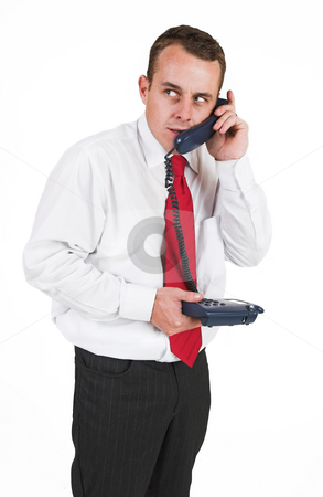 To use this stock image in your creative project, please select the size you need over to the right and click the "Add to Cart" button.
Your downloaded image will come with the Cutcaster watermark removed so don’t worry about the watermark you see on this page. Tollie Booysen #19 stock photo, Businessman in black trousers, white shirt and red tie.Talking on the phone by Sean Nel