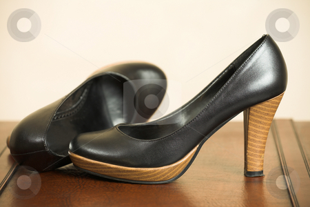 To use this stock image in your creative project, please select the size you need over to the right and click the "Add to Cart" button.
Your downloaded image will come with the Cutcaster watermark removed so don’t worry about the watermark you see on this page. Black Highheel shoes stock photo, Black leather high heeled shoes on a leather shelf by Sean Nel