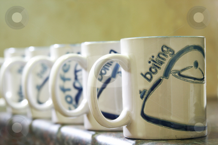 To use this stock image in your creative project, please select the size you need over to the right and click the "Add to Cart" button.
Your downloaded image will come with the Cutcaster watermark removed so don’t worry about the watermark you see on this page. Coffee Mugs stock photo, Coffe mugs lined up by Sean Nel
