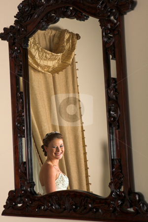 To use this stock image in your creative project, please select the size you need over to the right and click the "Add to Cart" button.
Your downloaded image will come with the Cutcaster watermark removed so don’t worry about the watermark you see on this page. Beautiful caucasian woman stock photo, Beautiful caucasian woman with brown hair wearing luxurious silk wedding dress looking in the mirror by Sean Nel