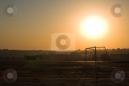 To use this stock image in your creative project, please select the size you need over to the right and click the "Add to Cart" button.
Your downloaded image will come with the Cutcaster watermark removed so don’t worry about the watermark you see on this page. Rural soccer field stock photo, Sunset on rural football field after a game of soccer by Sean Nel