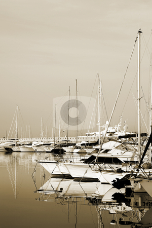To use this stock image in your creative project, please select the size you need over to the right and click the "Add to Cart" button.
Your downloaded image will come with the Cutcaster watermark removed so don’t worry about the watermark you see on this page. Antibes #279 stock photo, A harbor in Antibes, France. Sepia tone. Copy space. by Sean Nel