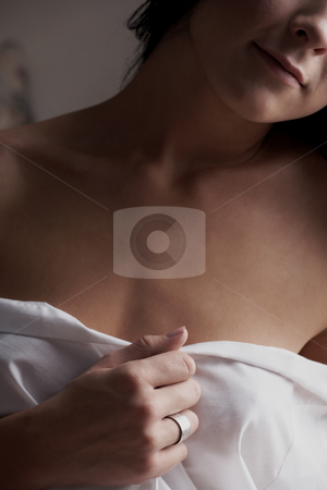 To use this stock image in your creative project, please select the size you need over to the right and click the "Add to Cart" button.
Your downloaded image will come with the Cutcaster watermark removed so don’t worry about the watermark you see on this page. Intimate young lovers stock photo, Young adult Caucasian couple in passionate embrace and undressing each other during sexual foreplay by Sean Nel