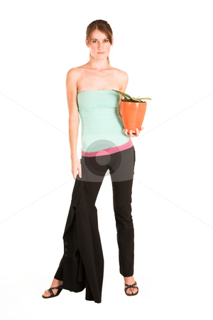 To use this stock image in your creative project, please select the size you need over to the right and click the "Add to Cart" button.
Your downloaded image will come with the Cutcaster watermark removed so don’t worry about the watermark you see on this page. Business Woman #437 stock photo, Brunette business woman in an informal light blue and pink shirt and black pants. Holding a potplant and a jacket. by Sean Nel