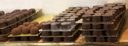 To use this stock image in your creative project, please select the size you need over to the right and click the "Add to Cart" button.
Your downloaded image will come with the Cutcaster watermark removed so don’t worry about the watermark you see on this page. Pastry #25 stock photo, Chocolate trays in a French Patisserie and Chocolaterie by Sean Nel
