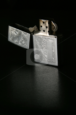 To use this stock image in your creative project, please select the size you need over to the right and click the "Add to Cart" button.
Your downloaded image will come with the Cutcaster watermark removed so don’t worry about the watermark you see on this page. Unlit lighter stock photo, Open unlit silver lighter by Sean Nel