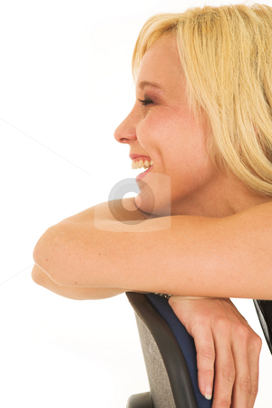 To use this stock image in your creative project, please select the size you need over to the right and click the "Add to Cart" button.
Your downloaded image will come with the Cutcaster watermark removed so don’t worry about the watermark you see on this page. BlondeFace #7 stock photo, Smiling blonde lady with silver jewelry, sitting on an office chair by Sean Nel