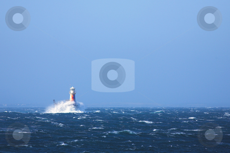To use this stock image in your creative project, please select the size you need over to the right and click the "Add to Cart" button.
Your downloaded image will come with the Cutcaster watermark removed so don’t worry about the watermark you see on this page. Lighthouse in the sea at Simons Town stock photo, The roman styled lighthouse inside the bay at Simons Town, Western Cape, South Africa. Extremely windy day with choppy water and large waves breaking against the lighthouse. by Sean Nel