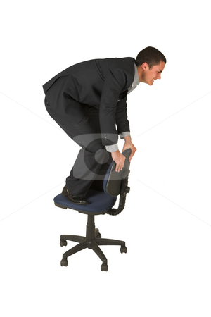 To use this stock image in your creative project, please select the size you need over to the right and click the "Add to Cart" button.
Your downloaded image will come with the Cutcaster watermark removed so don’t worry about the watermark you see on this page. Businessman #235 stock photo, Businessman wearing a suit and a grey shirt. Making a stunt on an office chair. by Sean Nel