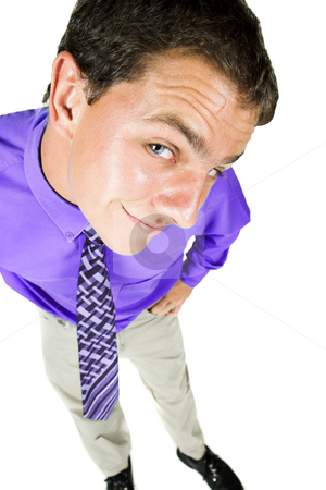 To use this stock image in your creative project, please select the size you need over to the right and click the "Add to Cart" button.
Your downloaded image will come with the Cutcaster watermark removed so don’t worry about the watermark you see on this page. Young adult businessman with distorted perspective stock photo, Young adult businessman standing looking up with a distorted perspective caused by a wideangle lens. He is smiling and in office wear, and is isolated on white so that he can be added to composition images with copy space. by Sean Nel