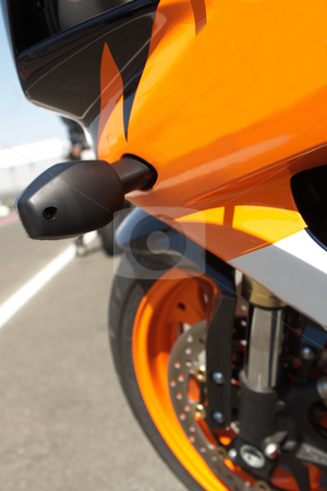 To use this stock image in your creative project, please select the size you need over to the right and click the "Add to Cart" button.
Your downloaded image will come with the Cutcaster watermark removed so don’t worry about the watermark you see on this page. Side of a superbike stock photo, Orange superbike next to the racetrack by Sean Nel