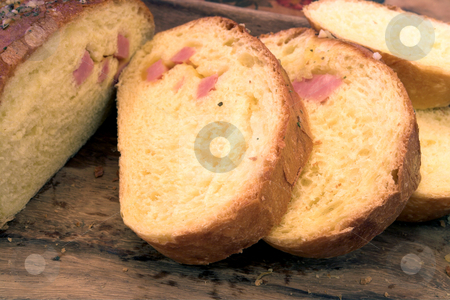 To use this stock image in your creative project, please select the size you need over to the right and click the "Add to Cart" button.
Your downloaded image will come with the Cutcaster watermark removed so don’t worry about the watermark you see on this page. Bread #5 stock photo, Slices ofbread on wooden board by Sean Nel