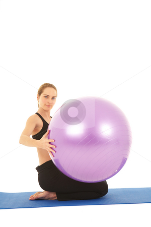 To use this stock image in your creative project, please select the size you need over to the right and click the "Add to Cart" button.
Your downloaded image will come with the Cutcaster watermark removed so don’t worry about the watermark you see on this page. Pilates exercise series stock photo, Fit young brunette pilates instructor showing different exercises on a white background with basic pilates equipment including a ball and yoga mat. White background, not isolated by Sean Nel