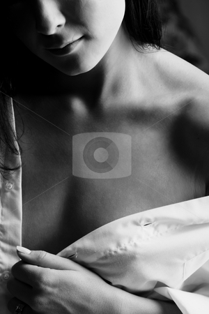 To use this stock image in your creative project, please select the size you need over to the right and click the "Add to Cart" button.
Your downloaded image will come with the Cutcaster watermark removed so don’t worry about the watermark you see on this page. Intimate young lovers stock photo, Young adult Caucasian woman in a white shirt and lingerie, undressing as a part of foreplay by Sean Nel