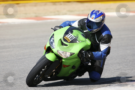 To use this stock image in your creative project, please select the size you need over to the right and click the "Add to Cart" button.
Your downloaded image will come with the Cutcaster watermark removed so don’t worry about the watermark you see on this page. Superbike #56 stock photo, High speed Superbike on the circuit by Sean Nel