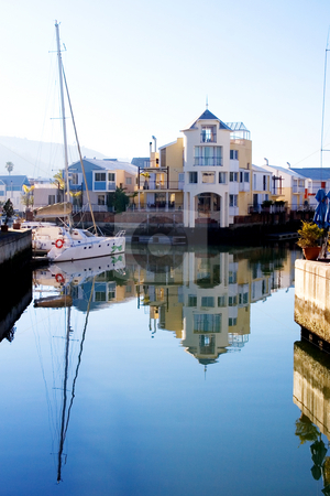 To use this stock image in your creative project, please select the size you need over to the right and click the "Add to Cart" button.
Your downloaded image will come with the Cutcaster watermark removed so don’t worry about the watermark you see on this page. Harbour #13 stock photo, Boats and big house at Knysna Harbour, South Africa by Sean Nel