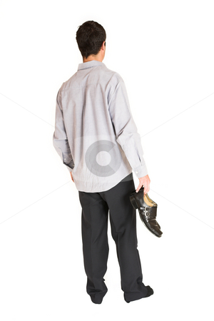To use this stock image in your creative project, please select the size you need over to the right and click the "Add to Cart" button.
Your downloaded image will come with the Cutcaster watermark removed so don’t worry about the watermark you see on this page. Businessman #107 stock photo, Businessman standing in socks, holding shoes in one hand. by Sean Nel