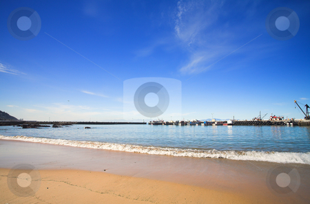 To use this stock image in your creative project, please select the size you need over to the right and click the "Add to Cart" button.
Your downloaded image will come with the Cutcaster watermark removed so don’t worry about the watermark you see on this page. Beach inside the harbour wall stock photo, The shallow beach inside the Kalkbay harbour, Western Cape, South Africa. Boats tied up at the docks on the horizon. by Sean Nel