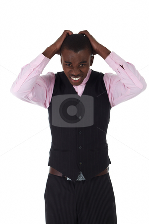 To use this stock image in your creative project, please select the size you need over to the right and click the "Add to Cart" button.
Your downloaded image will come with the Cutcaster watermark removed so don’t worry about the watermark you see on this page. Black African businessman stock photo, Young Adult black african businessman wearing a dark smart-casual outfit without a Jacket, but with a pink shirt and a dark waistcoat on a white background in various poses with various facial expressions. Part of a series, Not Isolated. by Sean Nel