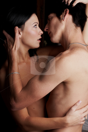 To use this stock image in your creative project, please select the size you need over to the right and click the "Add to Cart" button.
Your downloaded image will come with the Cutcaster watermark removed so don’t worry about the watermark you see on this page. Intimate young lovers stock photo, Young adult Caucasian couple in passionate embrace and undressing each other during sexual foreplay by Sean Nel