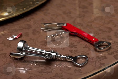 To use this stock image in your creative project, please select the size you need over to the right and click the "Add to Cart" button.
Your downloaded image will come with the Cutcaster watermark removed so don’t worry about the watermark you see on this page. Bottle openers stock photo, Bottle openers on glass by Sean Nel