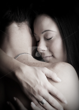 To use this stock image in your creative project, please select the size you need over to the right and click the "Add to Cart" button.
Your downloaded image will come with the Cutcaster watermark removed so don’t worry about the watermark you see on this page. Intimate young lovers stock photo, Young adult Caucasian couple in passionate embrace and undressing each other during sexual foreplay by Sean Nel