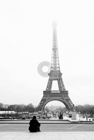 To use this stock image in your creative project, please select the size you need over to the right and click the "Add to Cart" button.
Your downloaded image will come with the Cutcaster watermark removed so don’t worry about the watermark you see on this page. Paris #43 stock photo, A person sitting, looking at the Eiffel Tower in Paris, France. Black and white. Copy space. by Sean Nel