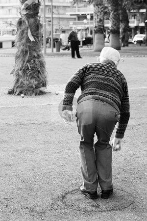 To use this stock image in your creative project, please select the size you need over to the right and click the "Add to Cart" button.
Your downloaded image will come with the Cutcaster watermark removed so don’t worry about the watermark you see on this page. Antibes #69 stock photo, An old man playing a ball game in Antibes, France. Black and white. Movement on person's right hand. Copy space. by Sean Nel