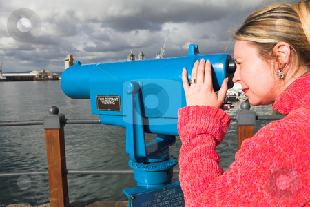 To use this stock image in your creative project, please select the size you need over to the right and click the "Add to Cart" button.
Your downloaded image will come with the Cutcaster watermark removed so don’t worry about the watermark you see on this page. Tourist using telescope stock photo, Coin operated view finder or telescope at the Cape Town Waterfront and port area by Sean Nel