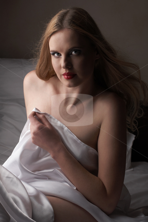 To use this stock image in your creative project, please select the size you need over to the right and click the "Add to Cart" button.
Your downloaded image will come with the Cutcaster watermark removed so don’t worry about the watermark you see on this page. Nude adult woman stock photo, Sensual naked young blonde adult Caucasian woman, wrapped in a satin, silk sheet. High contrast image. by Sean Nel