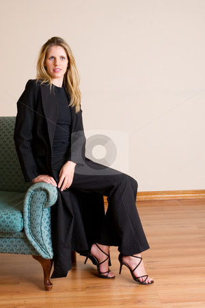 To use this stock image in your creative project, please select the size you need over to the right and click the "Add to Cart" button.
Your downloaded image will come with the Cutcaster watermark removed so don’t worry about the watermark you see on this page. Businesslady #80 stock photo, Blond haired busines woman, sitting on a couch by Sean Nel