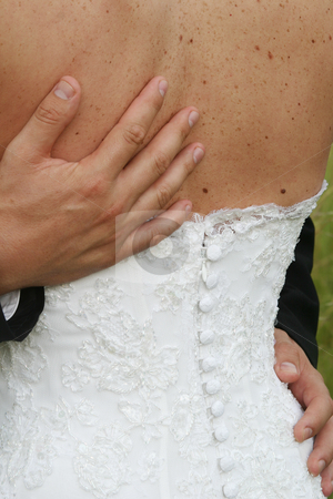 To use this stock image in your creative project, please select the size you need over to the right and click the "Add to Cart" button.
Your downloaded image will come with the Cutcaster watermark removed so don’t worry about the watermark you see on this page. Hands on back stock photo, His hands on her back by Sean Nel