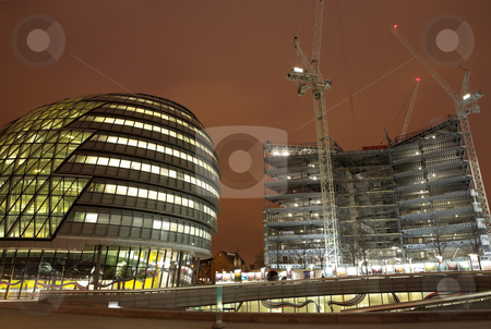 To use this stock image in your creative project, please select the size you need over to the right and click the "Add to Cart" button.
Your downloaded image will come with the Cutcaster watermark removed so don’t worry about the watermark you see on this page. London #48 stock photo, Office block and construction scene at nighttime. by Sean Nel