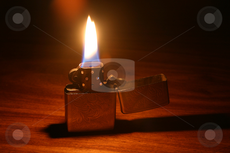 To use this stock image in your creative project, please select the size you need over to the right and click the "Add to Cart" button.
Your downloaded image will come with the Cutcaster watermark removed so don’t worry about the watermark you see on this page. Lit lighter stock photo, Open lighter with flame by Sean Nel