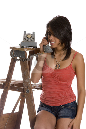 To use this stock image in your creative project, please select the size you need over to the right and click the "Add to Cart" button.
Your downloaded image will come with the Cutcaster watermark removed so don’t worry about the watermark you see on this page. Talking on the phone stock photo, Teenage girl standing on ladder talking on a old rotary phone by Yann Poirier