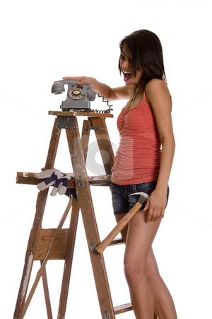To use this stock image in your creative project, please select the size you need over to the right and click the "Add to Cart" button.
Your downloaded image will come with the Cutcaster watermark removed so don’t worry about the watermark you see on this page. Slamming phone stock photo, Teenage girl standing on ladder screaming while slamming an old rotary phone by Yann Poirier