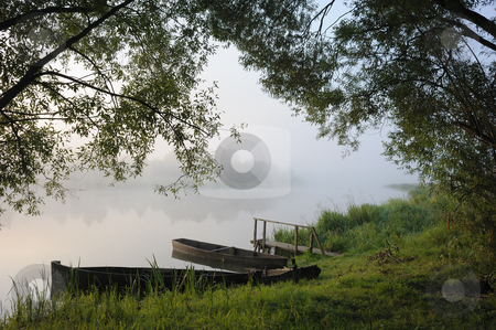 To use this stock image in your creative project, please select the size you need over to the right and click the "Add to Cart" button.
Your downloaded image will come with the Cutcaster watermark removed so don’t worry about the watermark you see on this page. Boats in a morning fog stock photo, Sunrise, boats at coast in a morning fog. by Vladimir Blinov