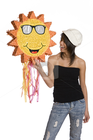 To use this stock image in your creative project, please select the size you need over to the right and click the "Add to Cart" button.
Your downloaded image will come with the Cutcaster watermark removed so don’t worry about the watermark you see on this page. Happy sunny teen stock photo, Teenage girl wearing a black tube top, knitted hat and jeans with holes holding a sunny pinata by Yann Poirier